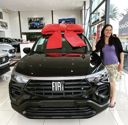 Cliente recebendo carro 0km pelo benefício PCD